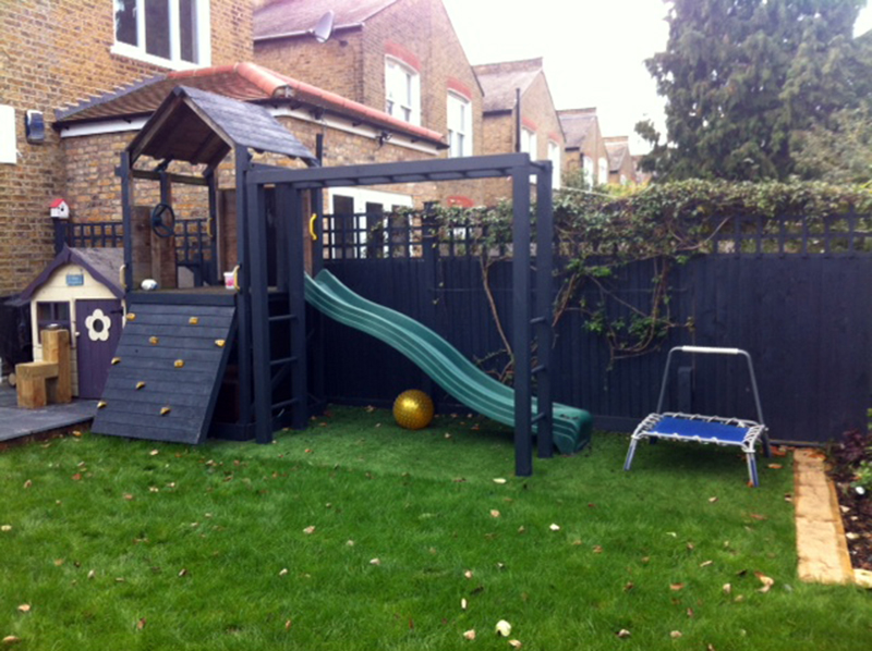Children's slide and playhouse in Clapham family garden